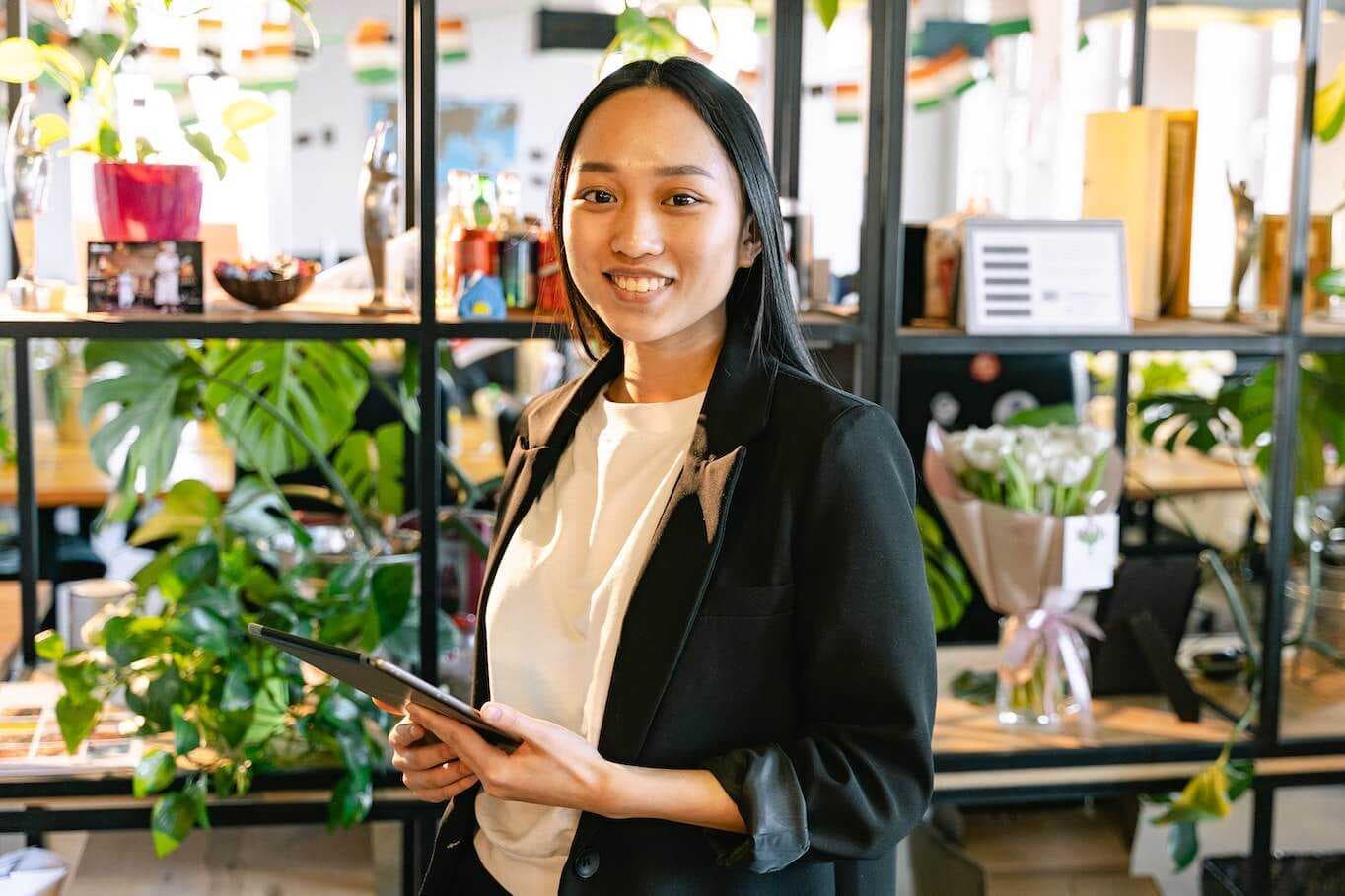 Woman smiling with tablet