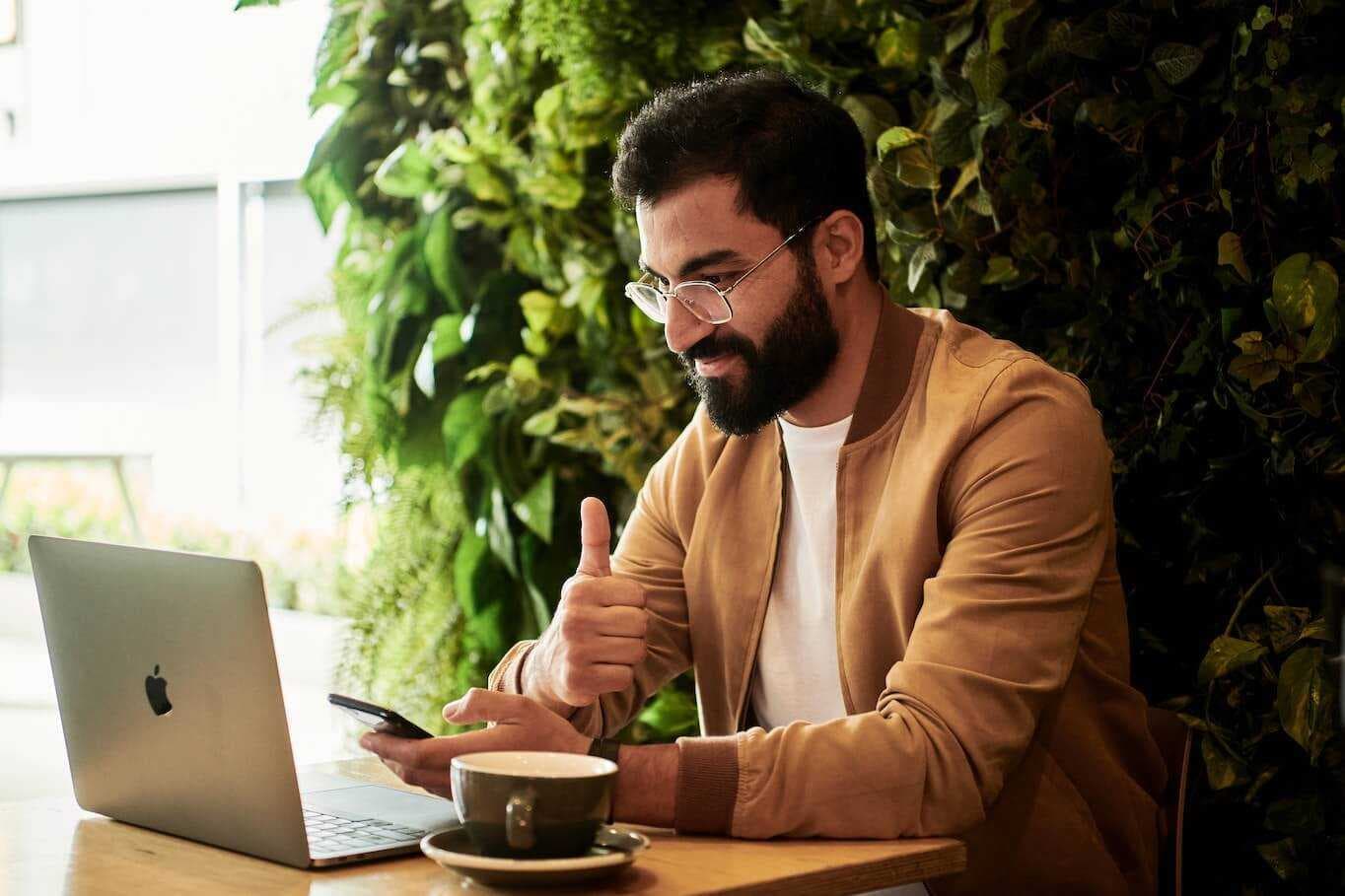 Happy customer in front of laptop